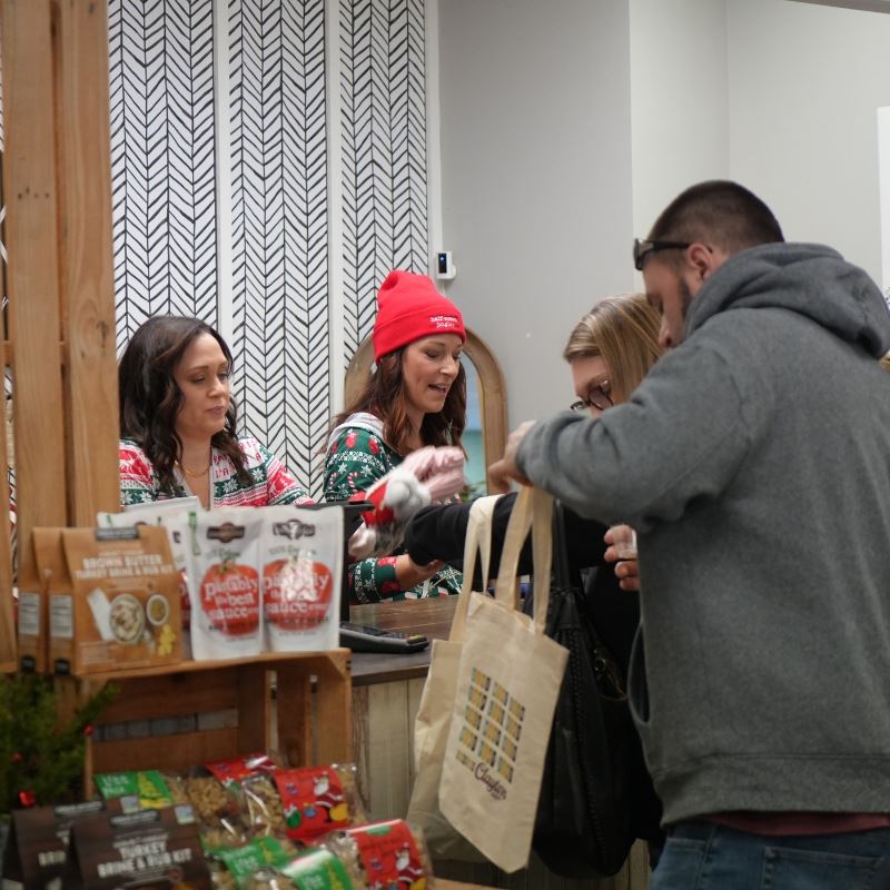 customers at check of small business on small business saturday