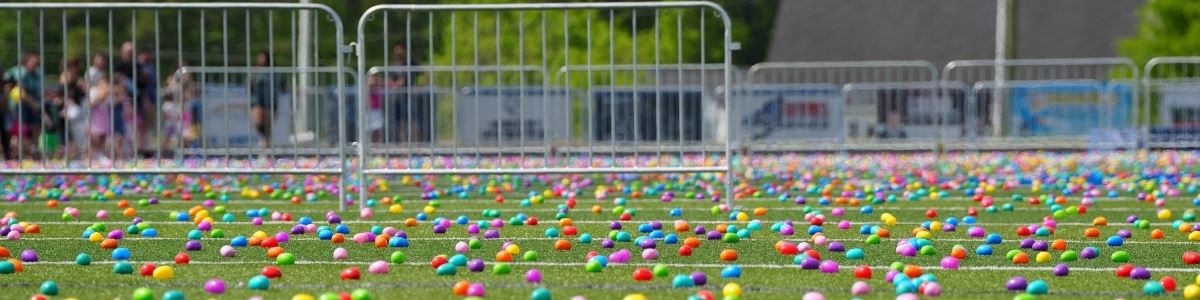 Hundres of Easter eggs spread out on clayton high school football field